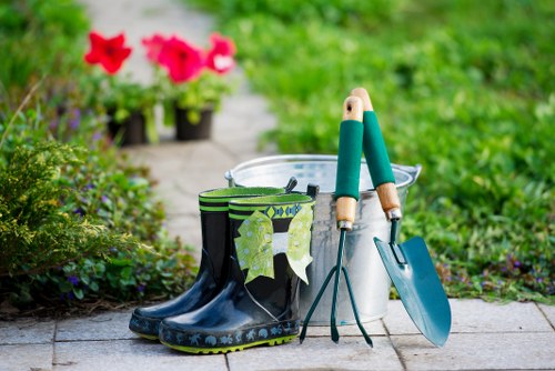 Uxbridge gardener pruning a rose bush